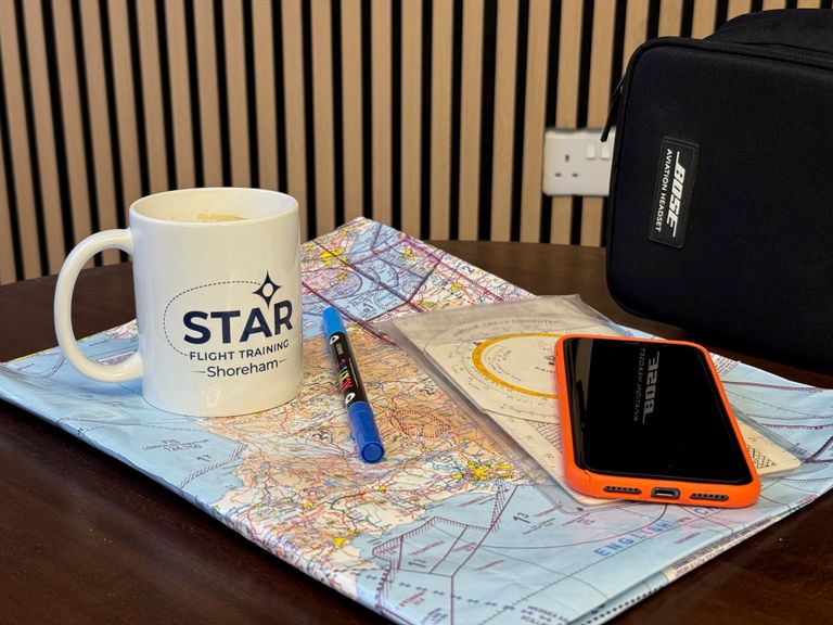 STAR Flight Training Mug and flight planning equipment in our clubhouse